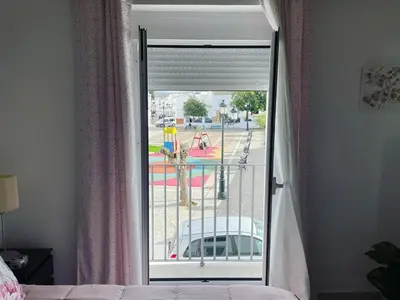 a room with a window with a view of a playground at Casa Delia in Bornos
