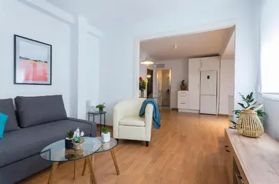 a living room with a couch and a table at Centrico Tranquilo 2 Rooms in Jerez de la Frontera