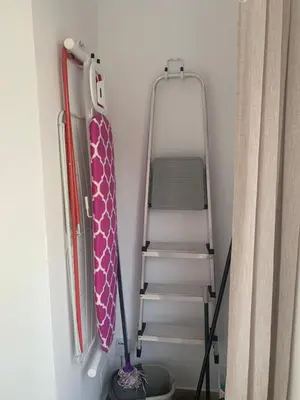 a ladder in a room with a stair case at Oloroso Home CERCA CENTRO in Jerez de la Frontera
