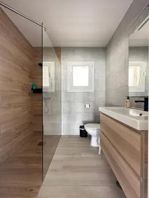 a bathroom with a sink and a toilet at Villa Luna Novo Santi Petri in Chiclana de la Frontera