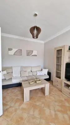 a living room with a couch and a coffee table at Villas Luins in Chiclana de la Frontera