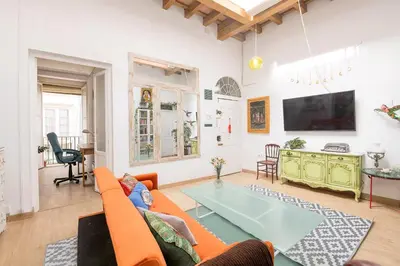 a living room with a couch and a table at Starlight in Cádiz
