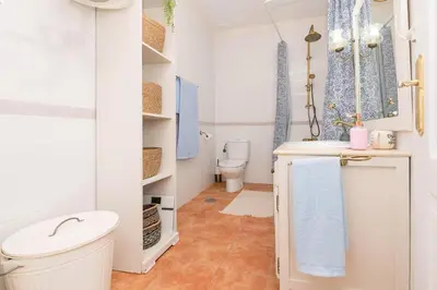 a bathroom with a toilet and a sink at Starlight in Cádiz