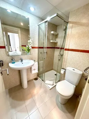 a bathroom counter with a sink and a mirror at GATU Cream, terraza, parking, aire acc, piscina común 