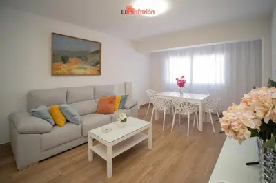 a living room with a couch and a table at El Anfitrión - Carmen Viejo in Sanlúcar de Barrameda