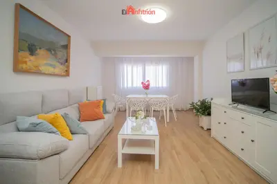 a living room with a couch and a table at El Anfitrión - Carmen Viejo in Sanlúcar de Barrameda