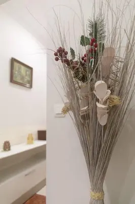 a vase filled with plants in a bathroom at Murillo by Gades Gestión in Cádiz