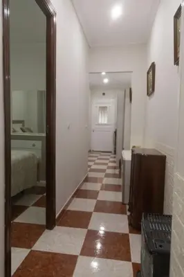 a hallway with a checkered floor in a room at Murillo by Gades Gestión in Cádiz