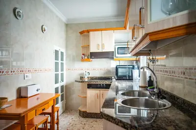 a kitchen with a sink and a counter at Apartamento céntrico con vistas in Arcos de la Frontera