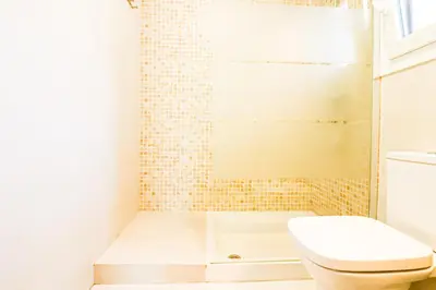 a bathroom with a toilet and a shower at La casita de la playa in Chiclana de la Frontera
