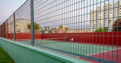 a deck with a wooden table and chairs on a balcony at GuestReady - Valdelagrana Carlos in El Puerto de Santa María
