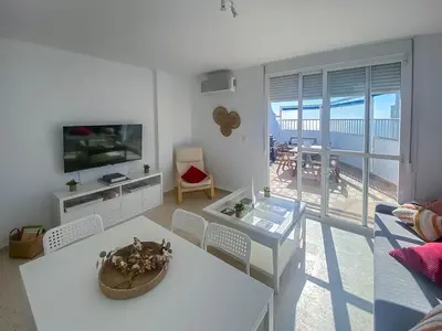 a living room with a couch and a table at GuestReady - Valdelagrana Carlos in El Puerto de Santa María