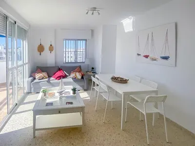 a bedroom with a bed in the corner of a room at GuestReady - Valdelagrana Carlos in El Puerto de Santa María