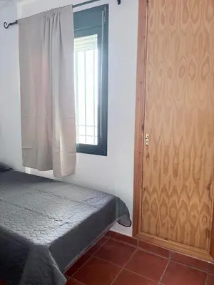 a living room with two couches and a lamp at La Barrosa, Aldea del Coto in Novo Sancti Petri