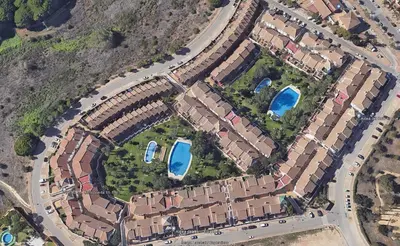 a bedroom with a bed with a pillow on it at La Barrosa, Aldea del Coto in Novo Sancti Petri