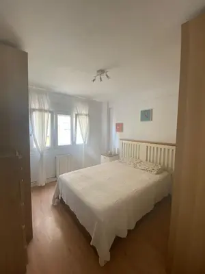 a bedroom with a white bed and a window at GATU Villa Dante Playa Victoria Parking gratuito, 