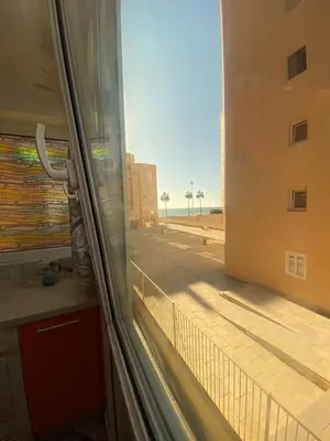 a view of a street from a window at GATU Villa Dante Playa Victoria Parking gratuito, 