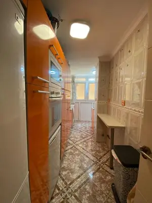 a kitchen with a refrigerator and a table in it at GATU Villa Dante Playa Victoria Parking gratuito, 