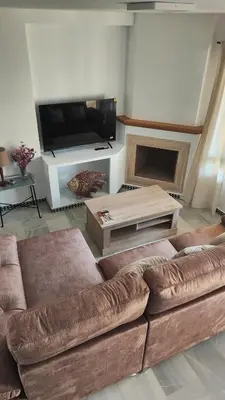 a living room with a couch and a flat screen tv at Novo Sancti Petri (Green 11) in Novo Sancti Petri