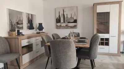 a dining room with a wooden table and chairs at Novo Sancti Petri (Green 11) in Novo Sancti Petri