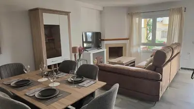 a living room with a table and a couch at Novo Sancti Petri (Green 11) in Novo Sancti Petri