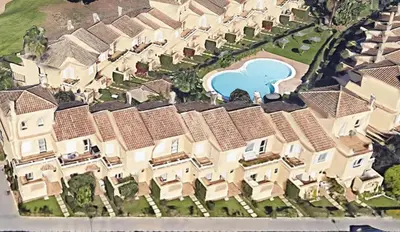 an aerial view of a house with a swimming pool at Novo Sancti Petri (Green 11) in Novo Sancti Petri