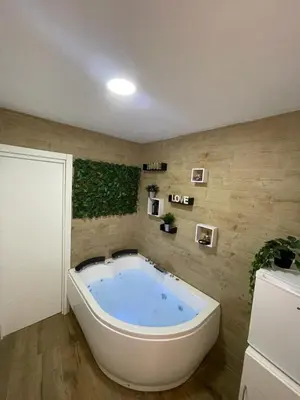 a large bath tub in a room with at Estudio BF jacuzzi jerez in Jerez de la Frontera