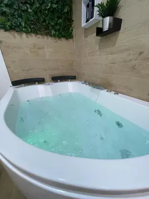 a bath tub filled with water in a bathroom at Estudio BF jacuzzi jerez in Jerez de la Frontera