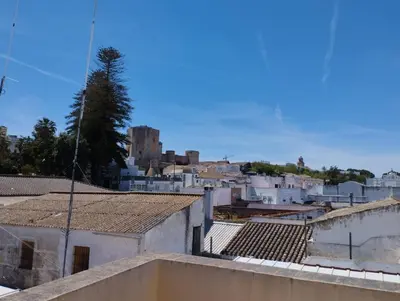 a view of a city from the roof of a building at L' Alcoba Rooftop in Sanlúcar de Barrameda