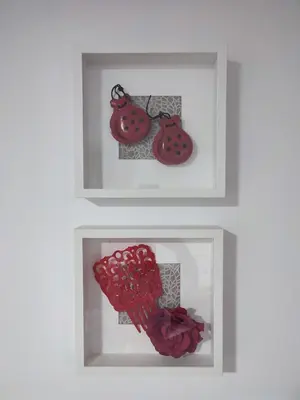 two framed pictures of a ladybug on a wall at Apartamento Gitanilla in Chipiona