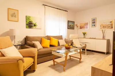 a living room with a couch and a table at El Patio de la Viña by Gades Gestión in Cádiz