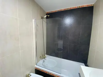 a bathroom with a shower and a bath tub at TU ESCONDITE in Jerez de la Frontera