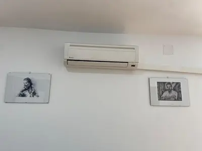 a white wall with pictures and a printer on it at TU ESCONDITE in Jerez de la Frontera