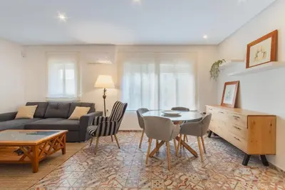 a living room with a couch and a table at Manolete apartamento in Jerez de la Frontera