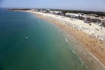 an aerial view of a beach and the ocean at Villa caracolillo PLAYA Chiclana in Chiclana de la Frontera