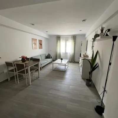 a living room with a couch and a table at piso en pleno centro in San Fernando