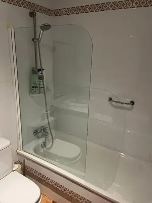 a bathroom with a shower and a toilet at Villa America in Roche