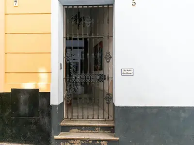 a door with a metal gate on a building at Holiday Home in Cadiz by the Sea in Cádiz