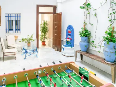 a living room with a pool table and plants at Holiday Home in Cadiz by the Sea in Cádiz
