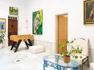 a living room with a table and a bench at Holiday Home in Cadiz by the Sea in Cádiz