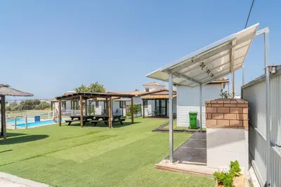 an image of a backyard with a pool and a pavilion at El Paraíso Perdido in Conil de la Frontera