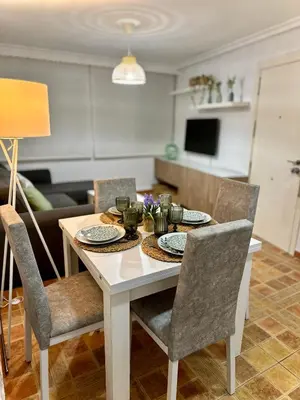 a dining room table with chairs and a dining room at Encanto Jerezano Hideaway - Apartamento en Jerez - Apartment in Sherry in Jerez de la Frontera