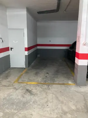 an empty garage with a red and white stripe on the wall at Disfruta Jerez in Jerez de la Frontera