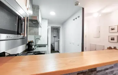 a kitchen with a wooden counter top in a room at Gorgeous Apartment In Rota With Wifi in Rota