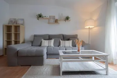 a living room with a couch and a coffee table at GINVA - Apartamento en pleno centro 2 in El Puerto de Santa María