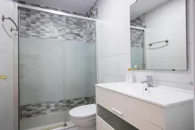 a bathroom with a toilet and a sink and a shower at GINVA - Apartamento en pleno centro 2 in El Puerto de Santa María