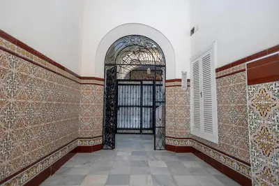 an entrance to a building with an iron gate at GINVA - Apartamento en pleno centro 2 in El Puerto de Santa María