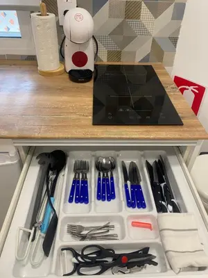 a drawer filled with utensils under a counter at Coqueto Mini piso / Estudio/ 20 metros / playa / Wifi in Chiclana de la Frontera