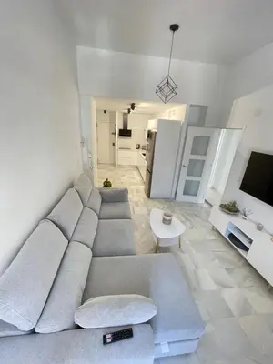 a living room with a couch and a table at Dublin apartment in El Puerto in El Puerto de Santa María
