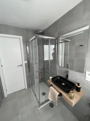 a bathroom with a shower and a black sink at Dublin apartment in El Puerto in El Puerto de Santa María